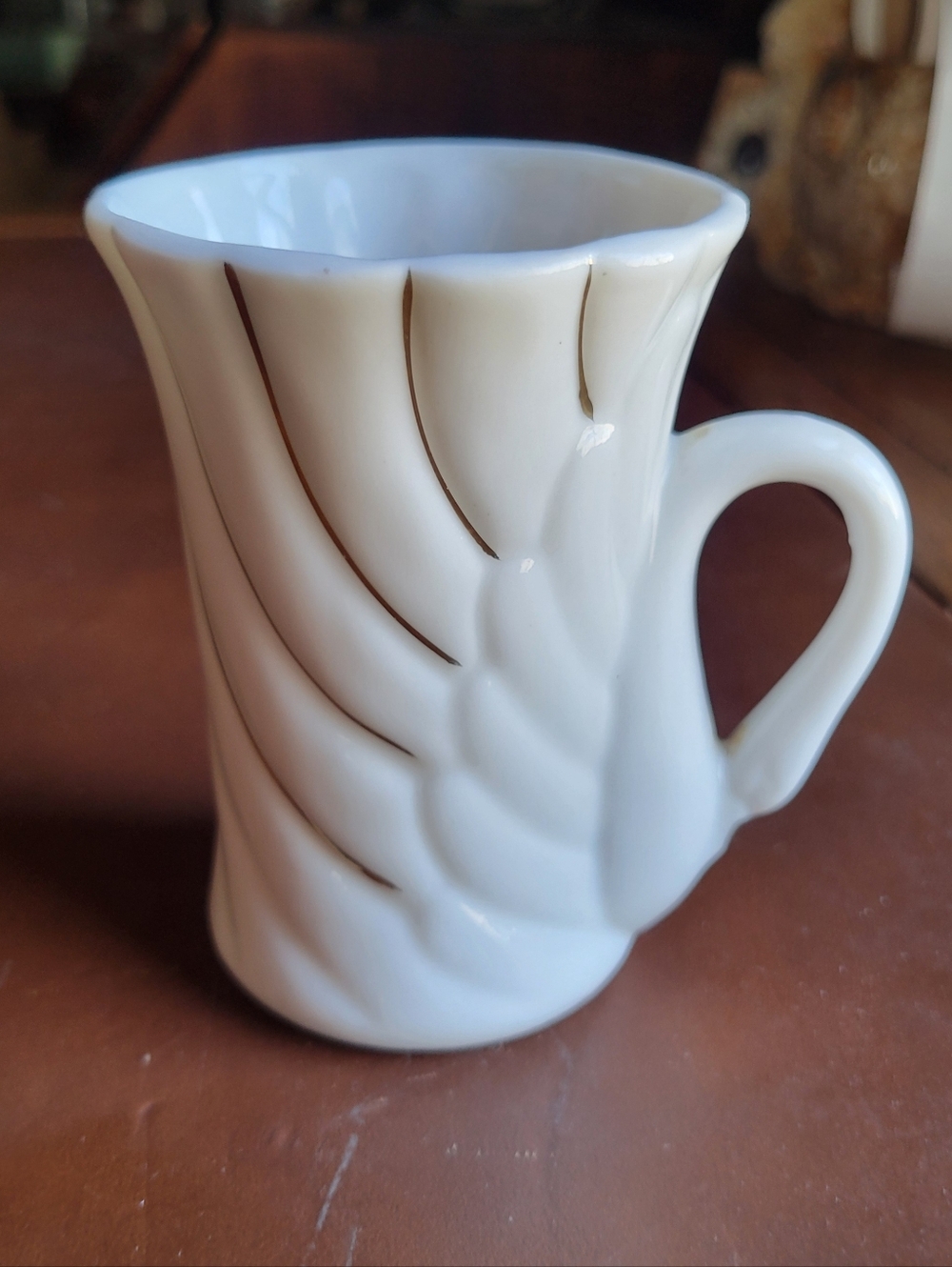 White Ceramic Mug with Sculpted Feather Detail